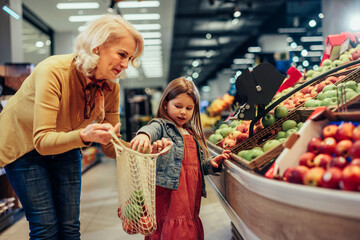 Grandmother and girl shopping in a grocery store