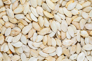 Roasted pumpkin seeds. Detail of pumpkin seeds background.