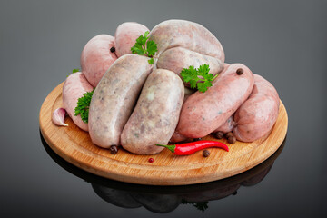 Meat sausages on a round board
