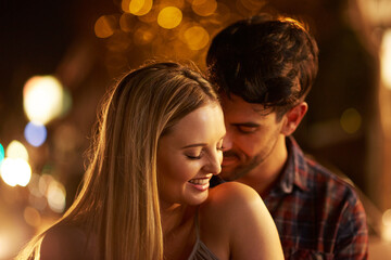 He makes me feel safe and at home. Shot of a young couple out on a date in the city.