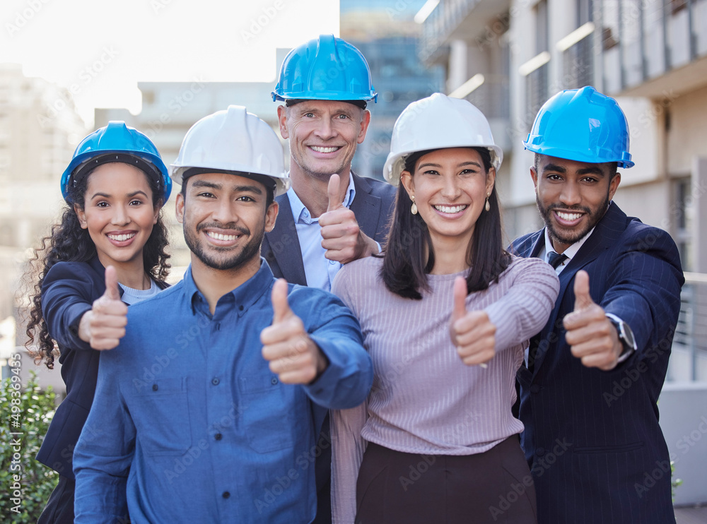 Poster leave the building to us. shot of a diverse group of businesspeople standing together and showing a 