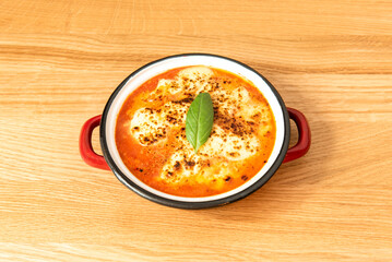 parmigiana, is a typical dish from Sicily and southern Italy. It is like a lasagna made from aubergines, with grated cheese, tomato sauce and basil leaves.