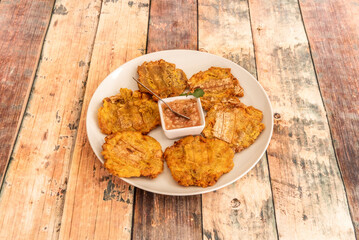 The fried patacón is a meal based on fried and flattened pieces of green plantain, traditional in the cuisine of several countries in the Americas, mainly in the Caribbean basin such as Venezuela
