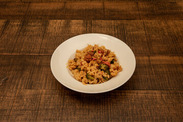 Fusilli is almost identical to other pastas called rotini. They are already similar in that both have a helical shape but the rotini is larger and thinner than the fusilli