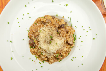 Delicious traditional Italian recipe, with creamy rice flavored with mushrooms, a touch of Parmesan cheese and truffle