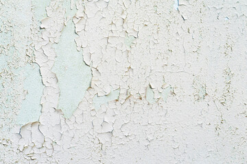 Old shabby painted concrete wall with stains, ruined plaster