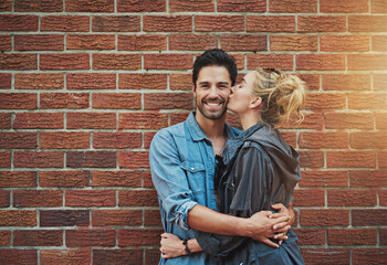 Together is my favourite place to be. Shot of a young couple out in the city.