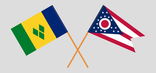 Fototapeta premium Crossed flags of Saint Vincent and the Grenadines and the State of Ohio. Official colors. Correct proportion