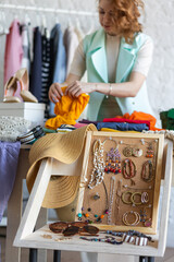 Young women at swap home party - clothes, shoes, bags, jewellery exchange between friends. Zero waste shopping, eco friendly concept, sustainable lifestyle. College life