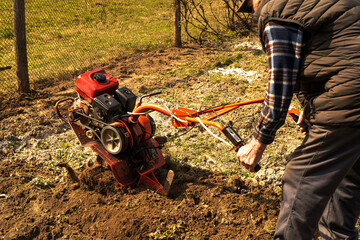 a man is cultivating a garden