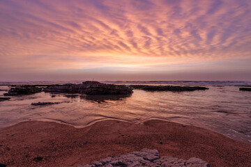Obraz premium Sunset on the beach of Nazare in Portugal