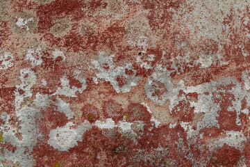 Red concrete wall weathered and decayed texture
