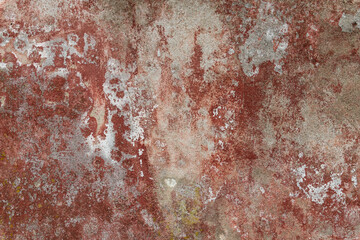Red concrete wall weathered and decayed texture