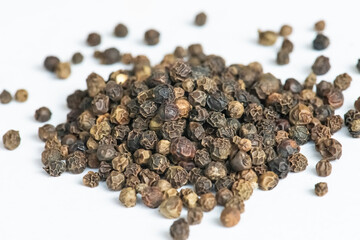 Black pepper on white background