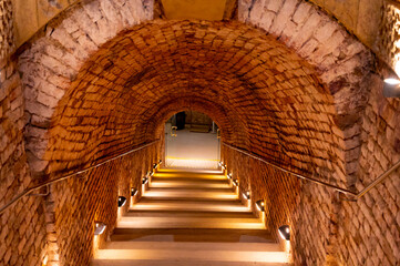 Sparkling wine production by traditional methods in underground cellars in Vienna, Austria, stair...