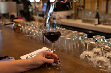 Tasting of dry Spanish tempranillo red wine in Spanish bogeda restaurant