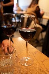 Tasting of dry Italian primitivo red wine in Italian cantina restaurant in Puglia