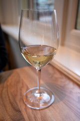 Glass of cold dry French sauvignon blanc white wine served in French restaurant
