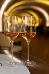 Tasting of brut champagne sparkling wine produced by traditional method in underground caves