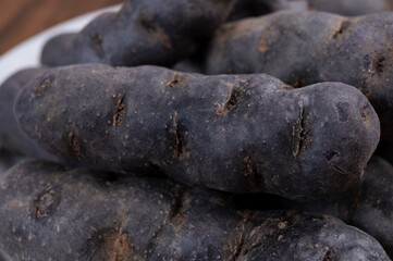 Fototapeta na wymiar Colorful belgian purple or black truffle potato root vegetable