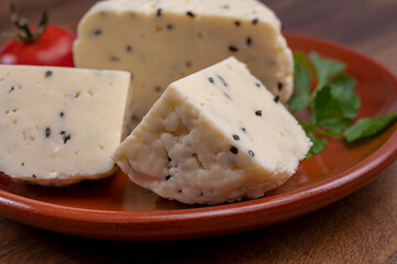 Traditional polish white cheese with black chives seeds made in North Poland in Kaszebe area near Gdynia.