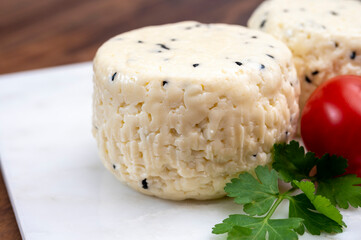 Traditional polish white cheese with black chives seeds made in North Poland in Kaszebe area near...