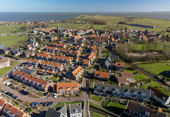 Fototapeta na wymiar Aerial view on small Dutch town Marken with wooden houses located on former island in North Holland, Netherlands