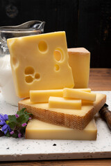 Swiss cheese collection, holes emmentaler and gruyere cheese made from unpasteurized cow's milk