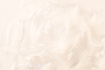 Closeup beige pink moisturizer, hygiene product, alcohol gel, liquide serum, shower gel, hand sanitizer, colored cream texture product sample with bubbles. Transparent abstract background