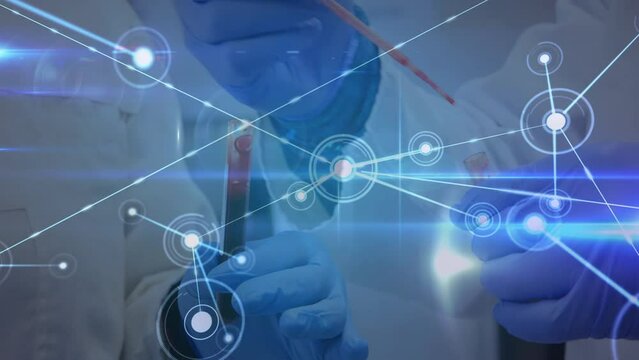 Animation of network of connections with icons over hands in protective gloves holding lab sample