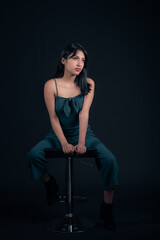 Fototapeta premium portrait of latina girl in photo studio isolated on black background
