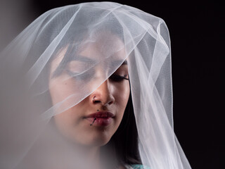close-up of portrait of latina woman with bridal veil