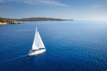 Aerial view of beautiful yacht. Boat on the sea at sunset in summer. Lefkada island, Greece. Top...