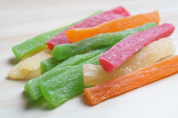 natural treat: multicolored sugary fruit candy sticks