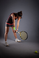 Professional female tennis player. Angry girl screaming with racket in hands..