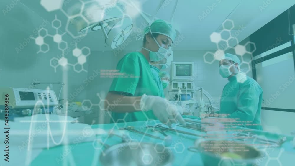 Poster animation of medical information and data processing over surgeons at work in operating theatre