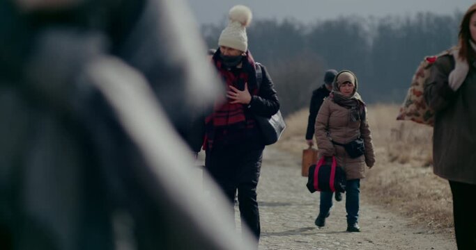 Depressed Refugees Walking While Migrating During War.