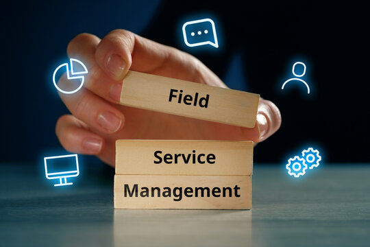 Acronym FSM or Field Service Management. Text on wooden cubes