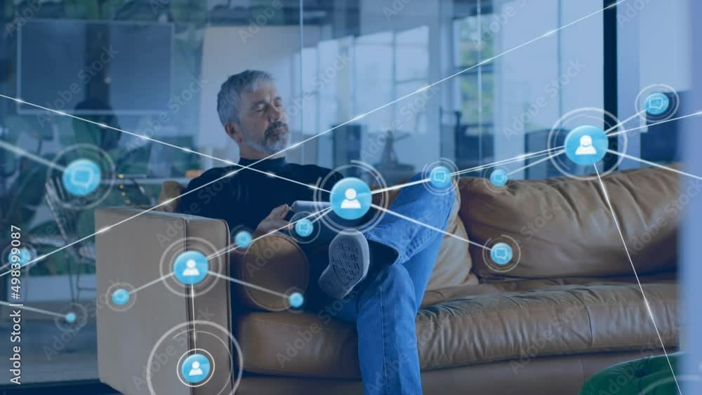 Aufkleber animation of network of connections with icons over caucasian businessman using tablet