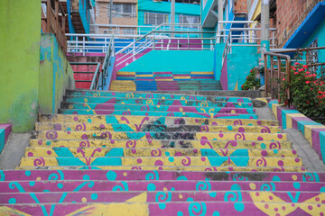 graffitied stairs in a hillside neighborhood