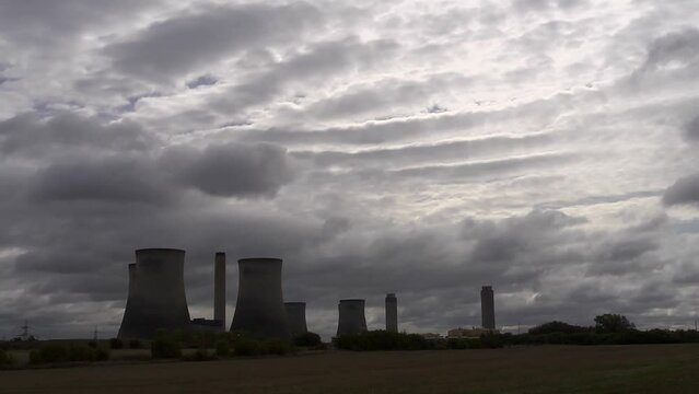 Time lapse clouds behind Didcot Power Station. Wide
