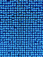 Full field texture of blue plastic rods stacked together