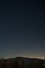 starry night sky over mountain