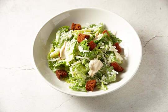 Overhead shot of gourmet chicken caesar salad