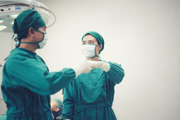 Fototapeta na wymiar The team of surgeons hand tags to show their cooperation to achieve the goal.