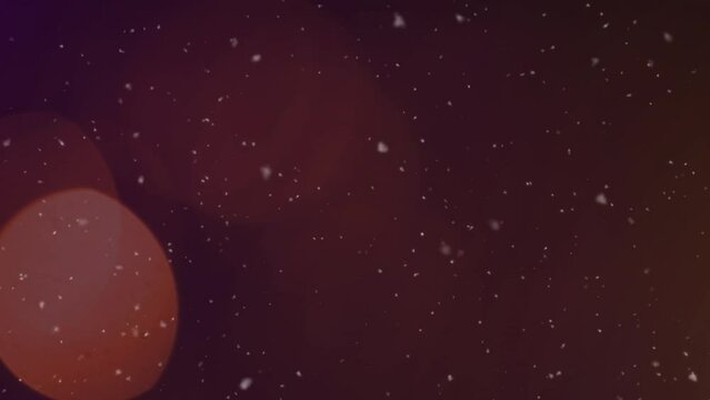 Animation of light spots and snow falling on black background