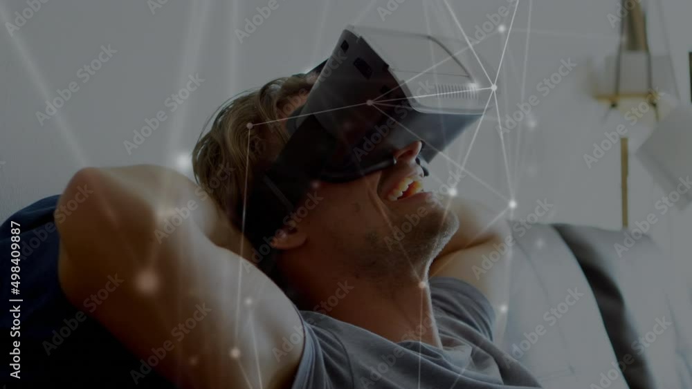 Poster animation of network of connections over caucasian man using vr headset