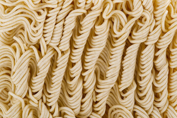 Raw Instant noodles. Close up instant noodles texture for background and packing design.