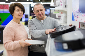 European spouses of mature age, who have come to the electronics and household appliances store for...