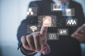 Businessman manager touching the virtual screen to document for management concept. Document management system (DMS). Management of documentation online, and digital file storage system or software.